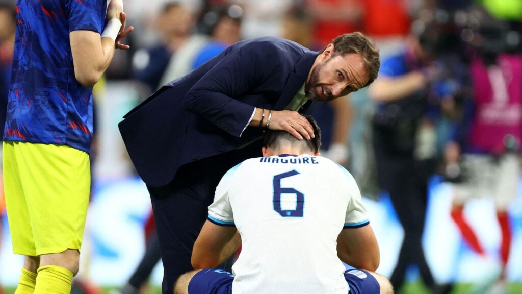 England manager Gareth Southgate consoles captain Harry Maguire