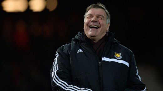 Sam Allardyce laughs during the game against Everton